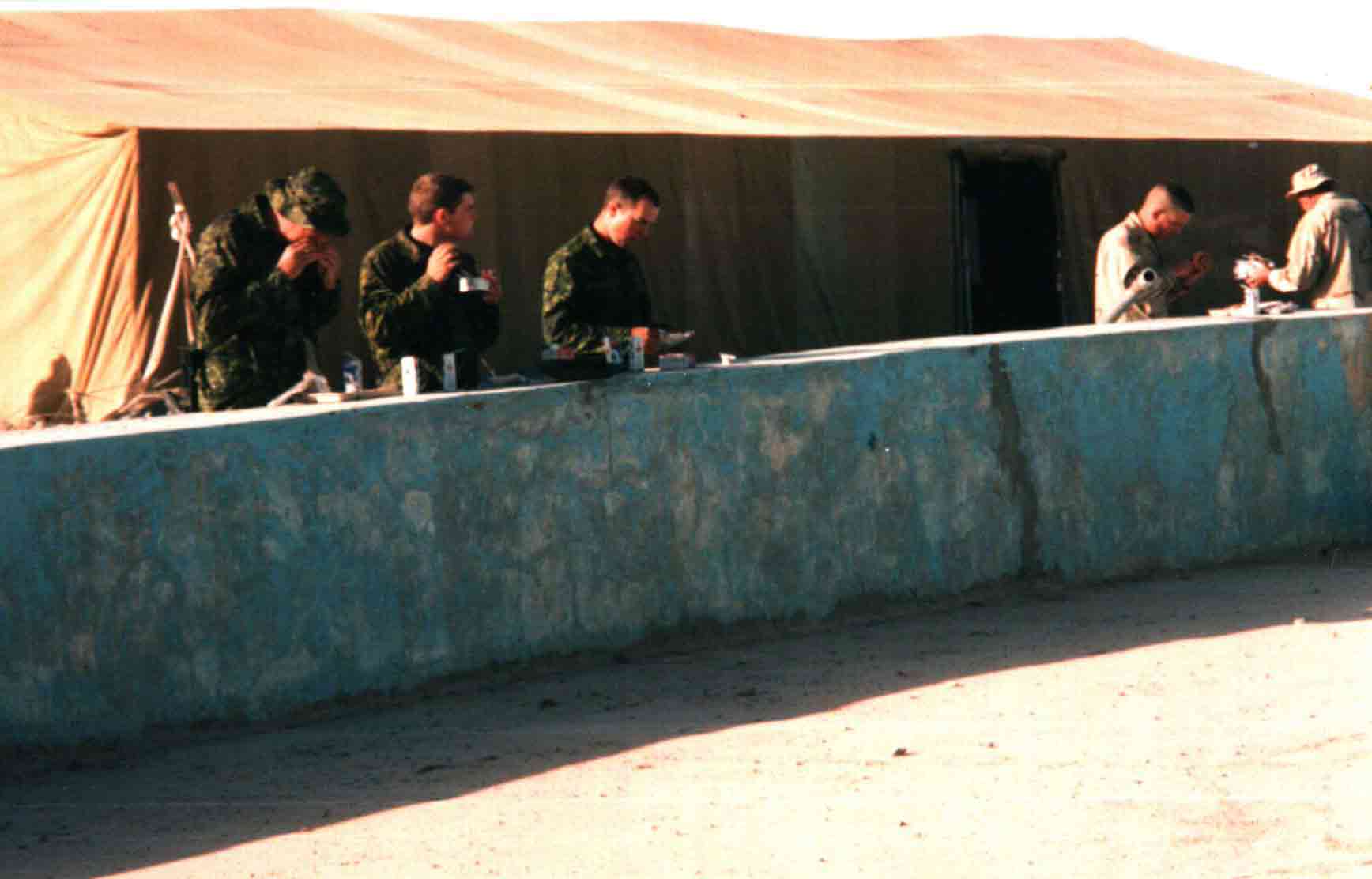 This is one for anyone out there who is familiar with the Boardwalk at Kandahar Air Field. It shows the dining facilities at the base in early 2002. The tent covers a bare concrete pad. No tables and chairs for the fine diners of Task Force Rakkasan.